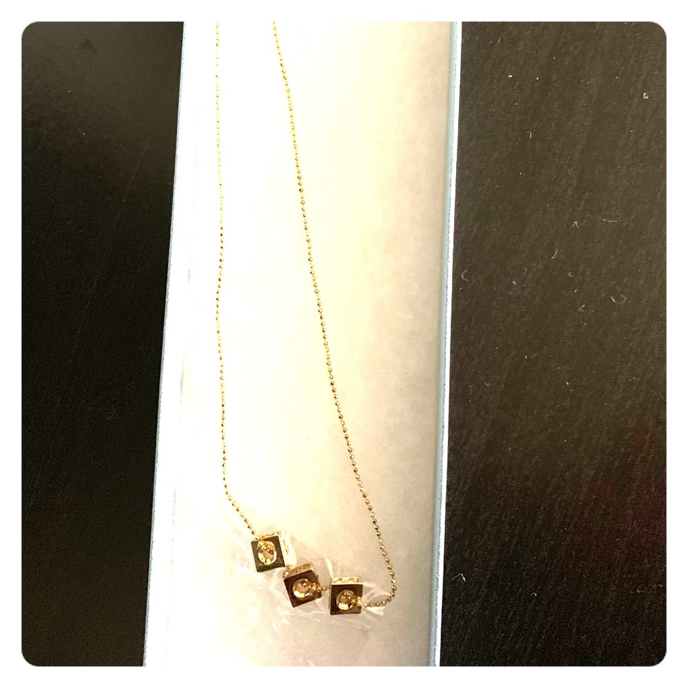 Triad gold pendant necklace